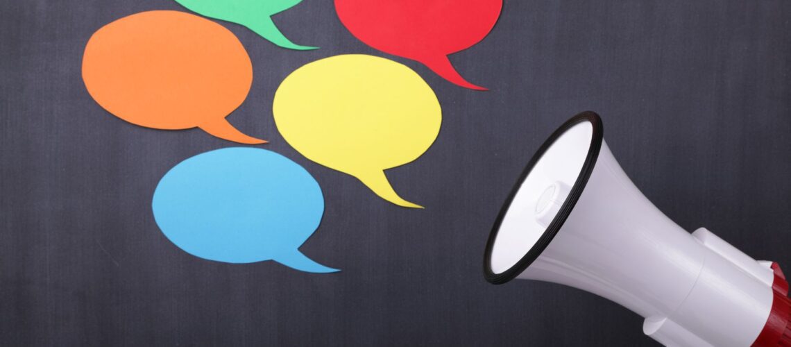 Communication amplification concept with megaphone and vibrant speech bubbles for leadership training