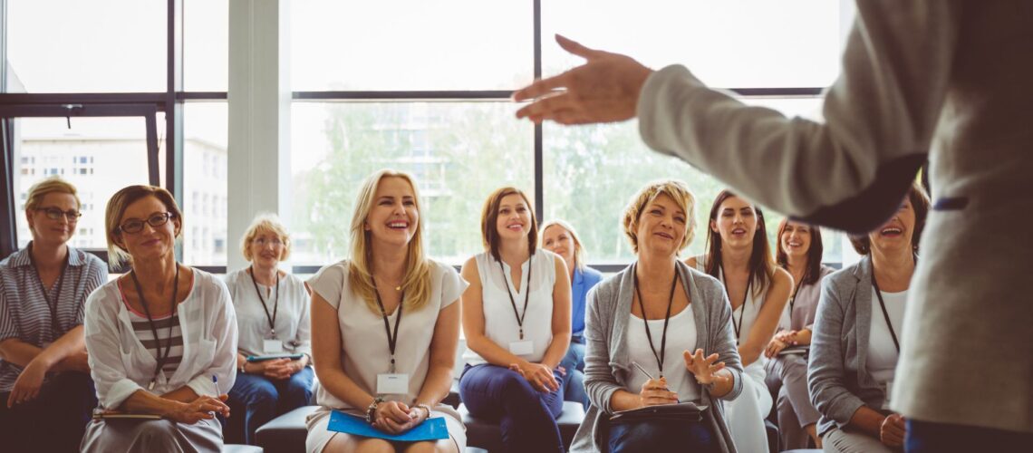 Professional woman looking upwards, symbolising career progression in business