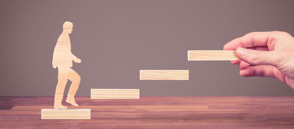 Professional climbing wooden steps representing career progression and skill development