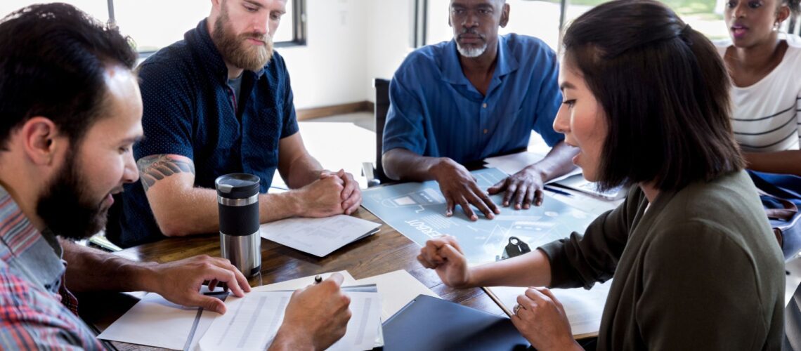 Team members in a meeting showing diverse personalities and communication styles