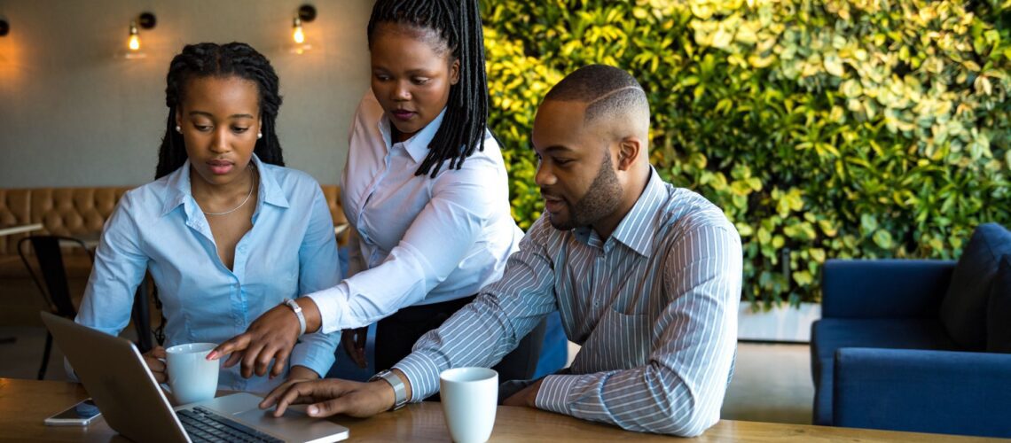 Leader guiding colleagues during a team project, symbolising accountability and commitment in the workplace