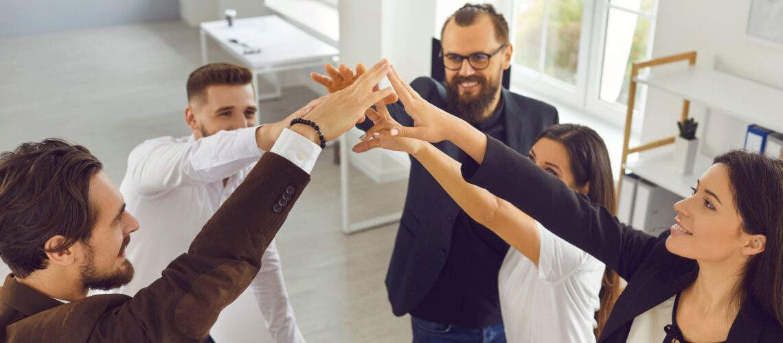 Team celebrating success with unity and trust, demonstrating resilient leadership and support