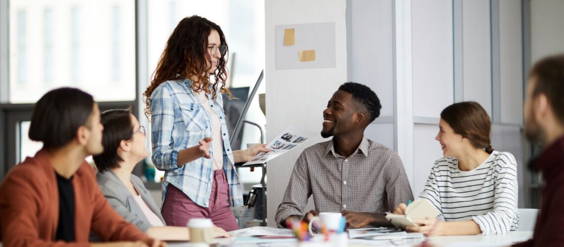 Professional diverse team engaged in leadership development workshop showing collaborative learning environment