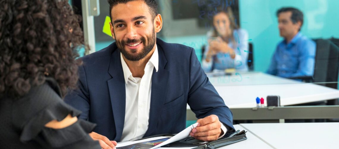 Confident manager demonstrating strategies for managing difficult employees in professional office environment