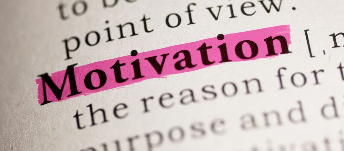 Motivation word highlighted in pink showing workplace motivation concept and employee engagement strategies