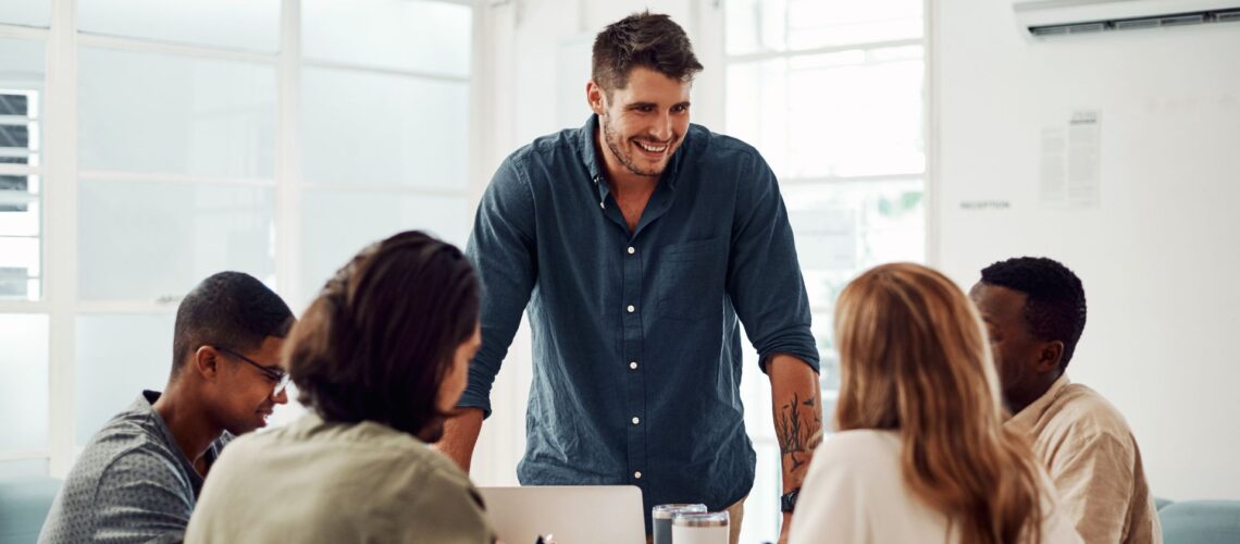 Leader building psychological safety in workplace with engaged diverse team members