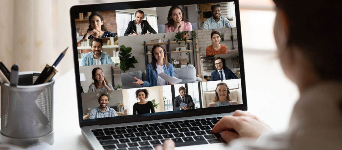 Diverse team engaged in productive video conference demonstrating effective remote communication strategies