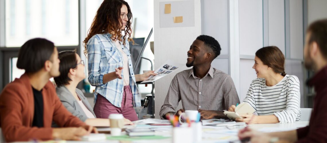 Diverse team collaborating in modern office meeting room during strategic planning session