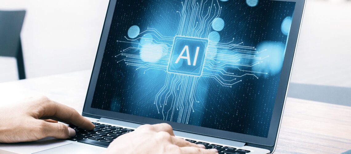 Hands typing on laptop displaying illuminated "AI" text with circuit board patterns, symbolizing artificial intelligence system management and oversight