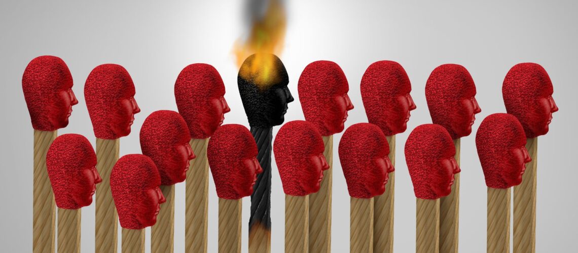 Conceptual image showing leadership burnout impact on team dynamics with burning matchstick