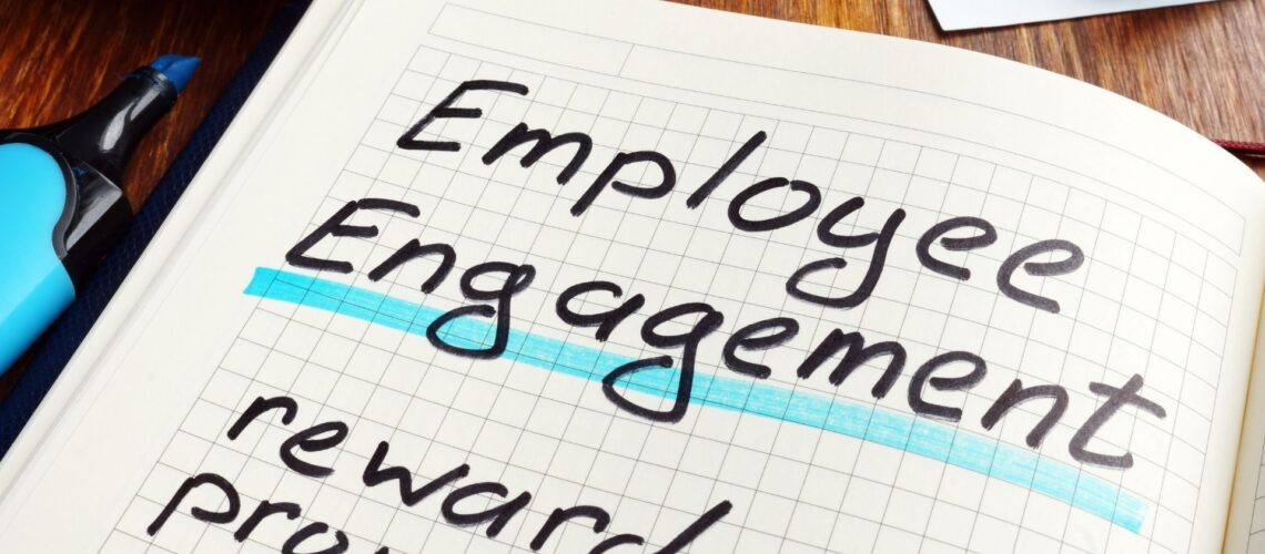 Employee engagement strategy written and highlighted in business planning notebook with pen, showing strategic HR planning