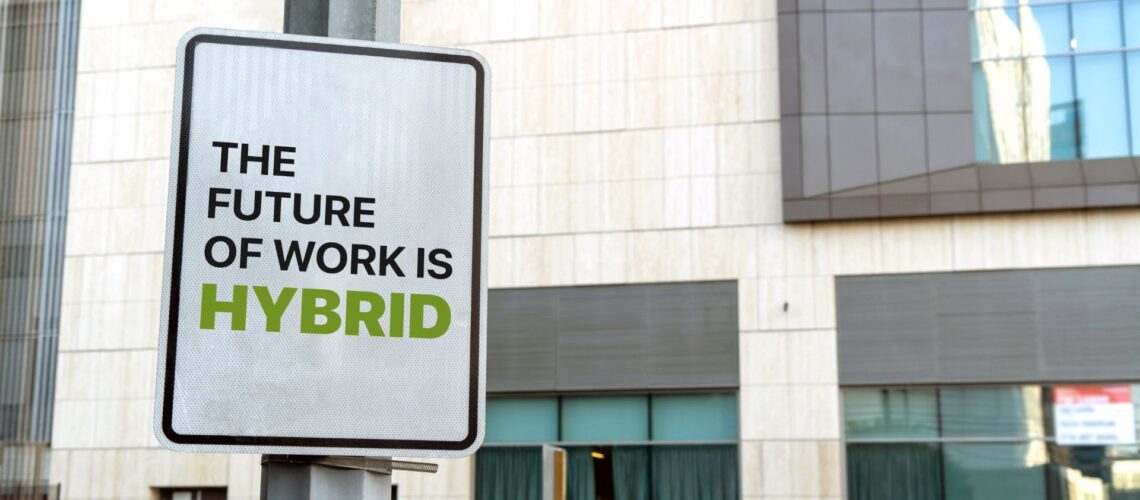Modern office building with "The Future of Work is Hybrid" signage representing workplace transformation