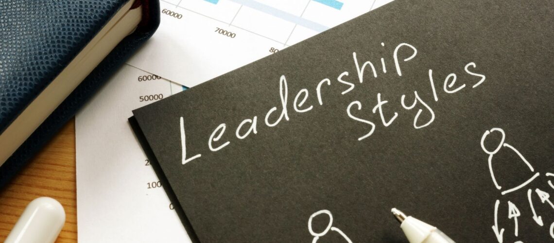 Leadership styles concept with strategic planning documents and analytical data showing different leadership approaches