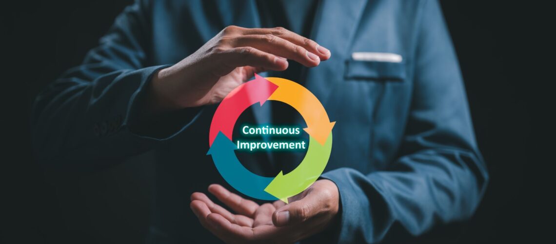 Professional holding continuous improvement cycle showing ongoing performance development process