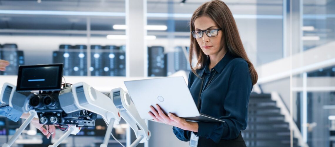 Engineer reviewing data on a laptop in a technical lab, reflecting the ownership mindset of a professional at work